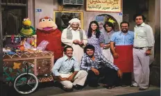  ??  ?? Tawfiq Al Asha(left) will be remembered in the Arab world for the character ‘Malsoun the Bird’ in the Arabic adaptation of ‘Sesame Street’, called ‘Iftah Ya Simsim’ (above), and also for his role in the hit comedy ‘Maraya’.