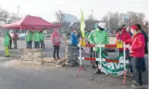  ?? — AFP ?? Unions members block a road where a car accident involving two fellow protesters took place earlier in the day during a national strike in the Belgium city of Ghent on Wednesday.