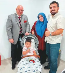  ??  ?? Professor Dr Michael Weber with Baby Mehmet Salih Demirrezen with Adam Demirrezen and his wife.