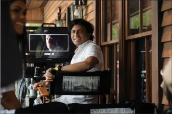  ?? UNIVERSAL PICTURES VIA AP ?? Director and co-writer M. Night Shyamalan on the set of his film “Knock at the Cabin,” his latest mashup of mystery and menace.