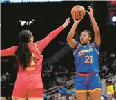  ?? KEVIN M. COX/AP ?? East forward Sarah Strong (21) shoots over West forward Kennedy Smith, left, during the first quarter of the McDonald’s All-American girls’ basketball game on Tuesday in Houston.