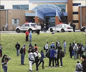  ?? MARSHALL GORBY / STAFF ?? Many Belmont High School students evacuated the building Wednesday morning after rumors circulated that another student had a gun.