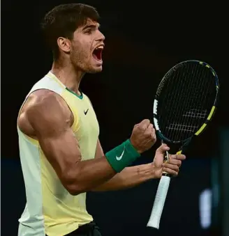  ?? GRAHAM DENHOLM/GETTY IMAGES ?? Carlos Alcaraz (above) had lots to celebrate during his straight-set victory over Miomir Kecmanovic to punch his ticket into the quarterfin­als.