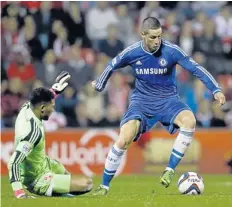  ??  ?? Fernando Torres, right, scored for Chelsea in their 2-0 win against Swindon.