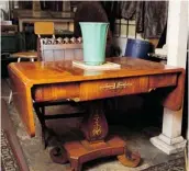  ??  ?? An antique wooden desk at Kavanagh Interiors.