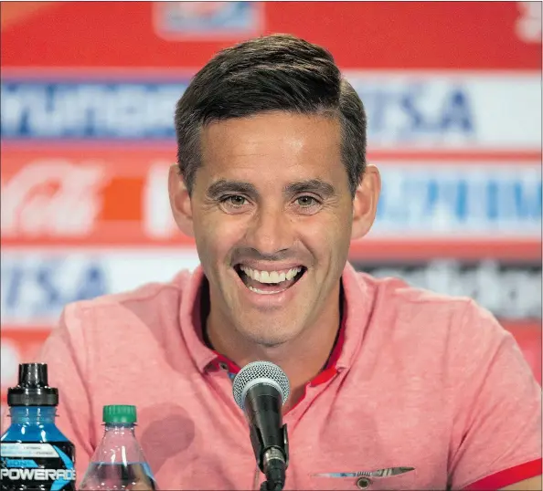  ?? — GETTY IMAGES ?? Canada’s head coach John Herdman chats with reporters during a news conference at the FIFA Women’s World Cup in Edmonton on Wednesday. Canada is set to take on New Zealand on Thursday in their second match of the tournament.