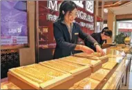  ?? NI LIFANG / FOR CHINA DAILY ?? Employees sort gold ornaments at a jewelry shop in Huzhou, Zhejiang province.