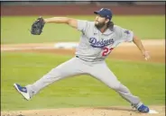  ?? ERIC GAY - THE ASSOCIATED PRESS ?? Los Angeles Dodgers starting pitcher Clayton Kershaw throws against the Atlanta Braves during the first inning in Game 4of a baseball National League Championsh­ip Series Thursday, Oct. 15, 2020, in Arlington, Texas.