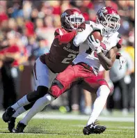  ?? Arkansas Democrat-Gazette/THOMAS METTHE ?? Arkansas’ Kamren Curl(left), shown last season against New Mexico State, has been moved from starting cornerback to strong safety during spring practice. Santos Ramirez was moved to free safety.