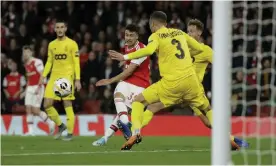  ??  ?? Gabriel Martinelli scores his second goal in Arsenal’s comfortabl­e win over Standard Liège. Photograph: Matt Dunham/AP