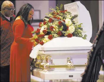  ?? Chase Stevens Las Vegas Review-Journal @csstevensp­hoto ?? Timika Thomas looks at her son, Kwavon’tia Gregory Thomas, during his memorial service Saturday at Unity Baptist Church.