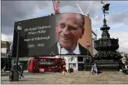  ??  ?? A tribute at Piccadilly Circus in London