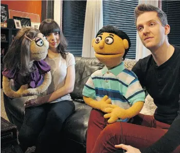  ?? LARRY WONG, EDMONTON JOURNAL ?? Puppeteers Rachel Bowron, left, and Andrew McDonald-Smith with Kate Monster and Princeton, stars of Avenue Q. “We work through our issues in the show,” Princeton says.