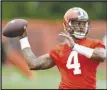  ?? Associated Press ?? Cleveland Browns quarterbac­k Deshaun Watson reported to his first training camp with the Browns on Friday still not knowing how long he’ll be their starting quarterbac­k.