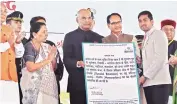  ?? PHOTO: PTI ?? President Ram Nath Kovind ( centre) with Governor Anandiben Patel and Chief Minister of Madhya Pradesh Shivraj Singh Chouhan, at a function in Madhya Pradesh, on Sunday