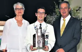  ??  ?? Grantleigh Headboy Ricardo Lopo received the Cultural Personalit­y of the Year award from Juriana Filmalter and Andrew Norris