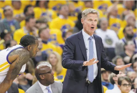  ?? Carlos Avila Gonzalez / The Chronicle ?? Steve Kerr in Game 2 of the first round, his last game before stepping away. Mike Brown, now acting head coach, is behind him.