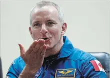  ?? DMITRI LOVETSKY
THE ASSOCIATED PRESS ?? Astronaut David Saint-Jacques blows a kiss through safety glass during a news conference Sunday in Kazakhstan.