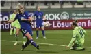  ?? Photograph: Swen Pf’rtner/AP ?? Svenja Huth scores for Wolfsburg despite Millie Bright’s attempt to block the ball.