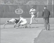  ?? Tim Godbee ?? Sonoravill­e senior shortstop Jaxon Pate puts the tag on a Christian Heritage baserunner.