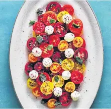  ?? PHAIDON • CANADIAN MANDA GROUP ?? Miniature tomatoes are drizzled with olive oil, garlic and lemon juice before being topped with balls of labneh and fresh herbs.