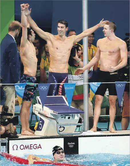  ?? Robert Gauthier Los Angeles Times ?? THE U.S. MEN’S 400-meter medley relay team celebrates winning a gold medal in Rio de Janeiro. Michael Phelps, center, gave the team the lead as he swam the butterfly leg and leaves Rio with five gold medals and one silver. He has a record 28 medals in his career.