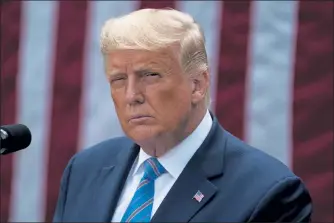  ?? EVAN VUCCI / AP ?? President Donald Trump pauses during a press conference in the Rose Garden of the White House Monday.