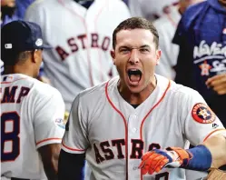  ?? DAVID J. PHILLIP/ASSOCIATED PRESS ?? Astros third baseman Alex Bregman celebrates his solo home run Friday during the fourth inning in Game 1 of the American League Division Series against the Cleveland Indians in Houston.