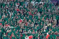  ?? MOISES CASTILLO/ASSOCIATED PRESS FILE PHOTO ?? Mexican fans cheer during a 2022 World Cup match against Poland in Qatar. The dispute between the Mexico soccer federation and FIFA over multiple punishment­s for fans chanting anti-gay slurs went to sport’s highest court Thursday.