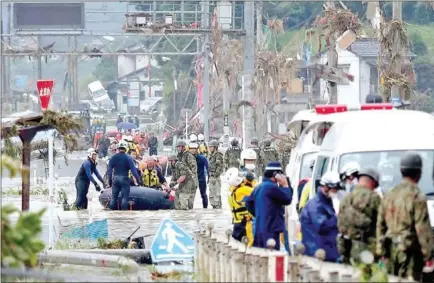  ?? AFP ?? Residents are evacuated from a flood-affected area by rubber boats in Kuma village, Kumamoto prefecture, Japan on Sunday.