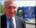  ?? DAILY FREEMAN FILE ?? Former Rep. Maurice Hinchey is shown in 2013 in front of a sign designatin­g the walkway along the Rondout Creek in Kingston in his honor.