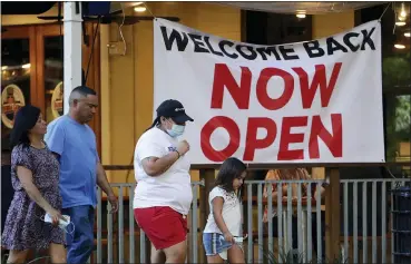  ?? ERIC GAY — THE ASSOCIATED PRESS ?? Visitors to the River Walk pass a restaurant that has reopened in San Antonio, Wednesday, May 27, 2020. Texas continues to reopen in the wake of the COVID-19pandemic.