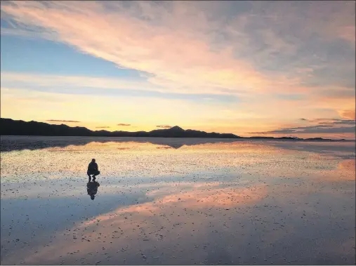  ?? JAMES FLETCHER/CP PHOTO ?? James Fletcher poses on some salt flats in Bolivia.