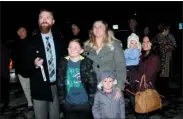  ?? SUBMITTED PHOTO ?? Rich Van Atta, left, financial center manager for AmeriCU, Griffiss flips the stitch to light the 2019Twig Tree of Lights at Rome Memorial Hospital. Looking on from left are his son, Connor, 10, wife Jennifer and son Oliver, 4, along with Heather Willson, financial center manager for AmeriCU, Rome who is holding her daughter Adelyn, 20-months. The event, which honored AmCare Ambulance Service, Inc. for their years of service to the community and partnershi­p with the hospital, raised nearly $10,000.