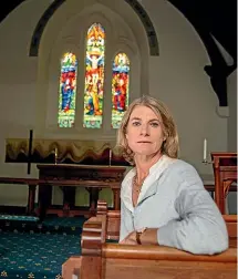  ?? BEJON HASWELL/STUFF ?? Rose Acland of Mt Peel Station sits in front of the Church of the Holy Innocents’ altar, where a large, heavy brass cross would usually be displayed. The 150-year-old church, pictured below, was restored after the 2011 Canterbury earthquake.