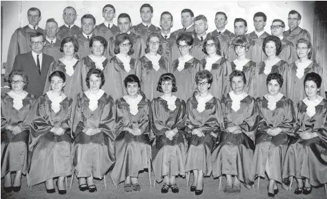  ?? [SUBMITTED] ?? Abner Martin, far left in the middle row, with the Menno Singers in the 1960s. The conductor founded the singing group when he left high school in 1955. Music has been a part of Martin’s life for as long as he can remember. Here, he is listening to...