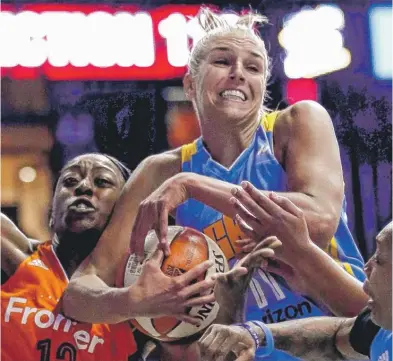  ?? | NAM Y. HUH/ AP ?? Sky forward Elena Delle Donne battles Sun center Chiney Ogwumike for a rebound in the first half Friday night.