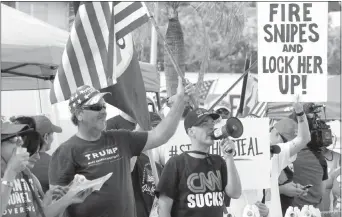  ?? CARL JUSTE/ MIAMI HERALD VIAAP ?? Protesters gather outside the Broward County Supervisor of Elections Office in Florida as the statewide election recount is underway under the watchful eye of representa­tives of both parties and the campaigns Nov. 11.