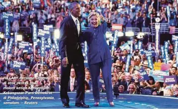  ??  ?? HILLARY bersama Obama di atas pentas pada malam ketiga Konvensyen Kebangsaan Parti Demokrat di Philadelph­ia, Pennsylvan­ia, semalam. - Reuters