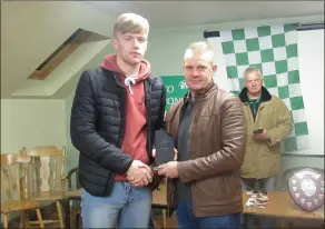  ??  ?? William Hanlon accepts the Player of the Year award from Kevin O’Brien at the awards night.
