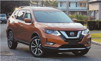  ?? STAFF PHOTO BY JIM MAHONEY ?? COMPLIMENT­S: The 2018 Nissan Rogue earned kudos from a passing motorist for its Monarch Orange paint.