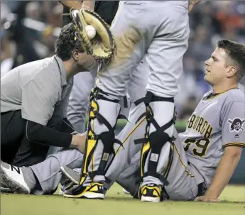  ?? Lynne Sladky/Associated Press ?? Pirates starter Chad Kuhl was hit by a comebacker in the fifth inning Sunday against the Marlins and had to leave the game.