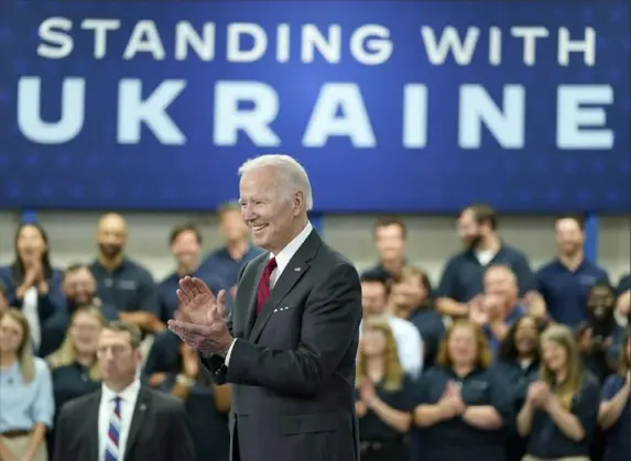  ?? Evan Vucci/Associated Press ?? President Joe Biden, who is scheduled to deliver a key speech next week to mark one year of Russia’s war on Ukraine, smiles before speaking on security assistance to Ukraine during a May visit to the Lockheed Martin Pike County Operations facility in Troy, Ala.