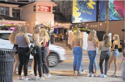  ?? KARL MERTON FERRON/BALTIMORE SUN ?? A crowd waits in line outside Terrapin’s Turf on Knox Avenue on Sept. 11 near the University of Maryland’s College Park campus.