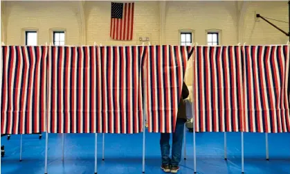  ?? Photograph: Joseph Prezioso/AFP/Getty Images ?? A person votes in Concord, New Hampshire, in 2020.