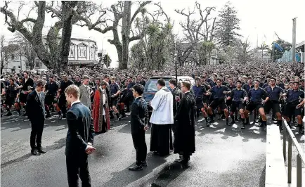  ?? PHOTO: GETTY IMAGES ?? Students from Auckland Grammar school perform a haka following the funeral service for Sir John Graham yesterday in Auckland.