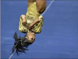  ??  ?? DENNIS’ FLOOR routine, in which she launches herself eight feet in the air, has drawn social media praise from Michelle Obama to Simone Biles.