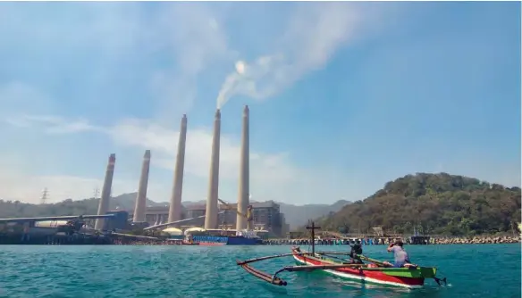  ?? (AFP) ?? Smokestack­s belch noxious fumes into the air from a massive coal-fired power plant on the Indonesian coast.