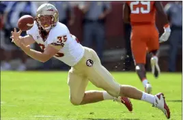  ?? Richard Shiro The Associated Press ?? Tight end Nick O’leary stretches out for a reception in 2011 while playing at Florida State. Recently signed by the Raiders, O’leary was placed on the reserve/nonfootbal­l injury list after undergoing two surgeries to clear 100 percent blockage to his heart.