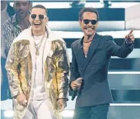  ?? LYNNE SLADKY/AP ?? Daddy Yankee, left, with Marc Anthony.